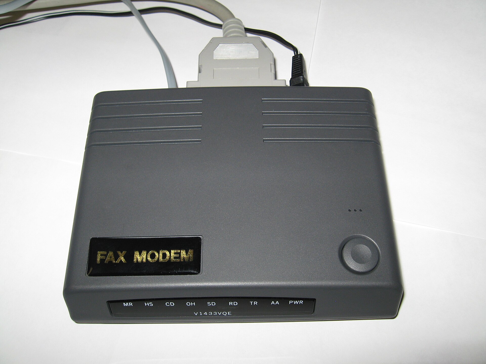 A grey external fax modem with a row of status lights and a serial cable.