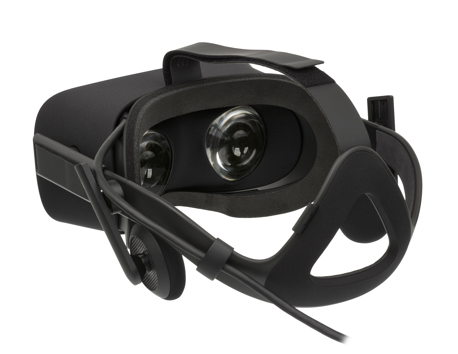 A black PC VR headset seen from the back, showing its lenses, face foam and strap.